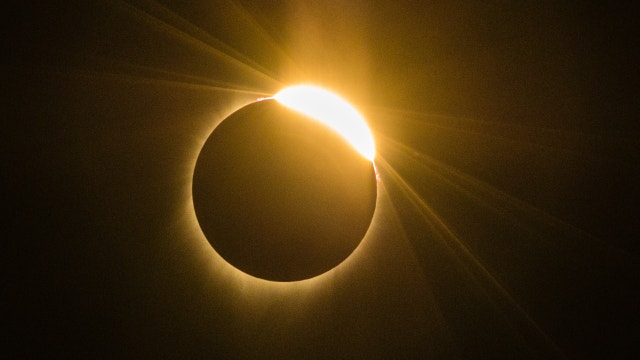 Track the solar eclipse as it moves over Chicago, Illinois and Indiana