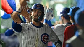 Swanson’s tiebreaking 2-run homer, Suzuki’s grand slam lift Cubs past Reds 7-5 at wet Wrigley Field