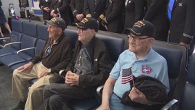 Bagpipes, flags welcome WWII veterans heading back to France for D-Day anniversary