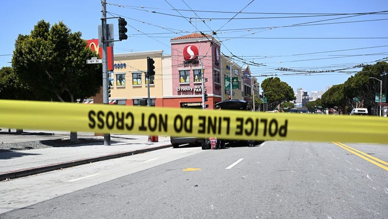 FILE - Police cordon off the scene after a deadly incident occurred at a bus stop in San Francisco, California, on May 23, 2023. (Photo by Tayfun Coskun/Anadolu Agency via Getty Images)