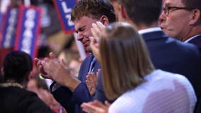 ‘That’s my dad!': Gus Walz tearfully cheers on his father as he accepts Democratic VP nomination