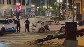 Car blows red light on Michigan Avenue, crashes into SUV and knocks down light pole