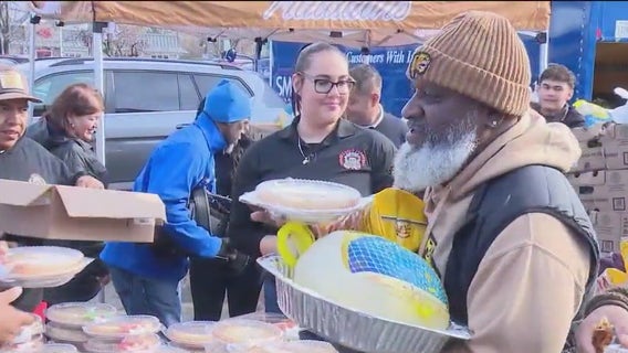 Hundreds receive turkeys and pies in Thanksgiving holiday giveaway