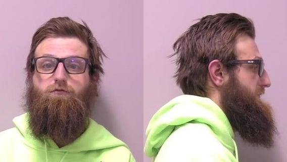 Man arrested for pointing loaded handgun at traffic from inside St. Charles bar, police say