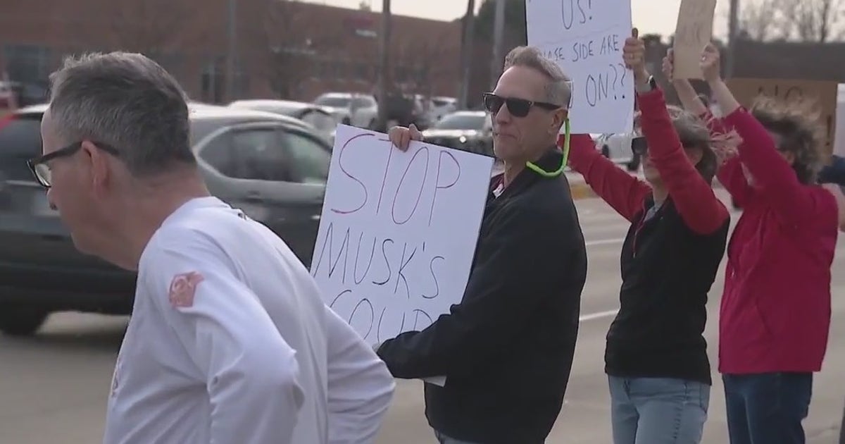 Protesters rally against Elon Musk in Schaumburg, call for Tesla ...