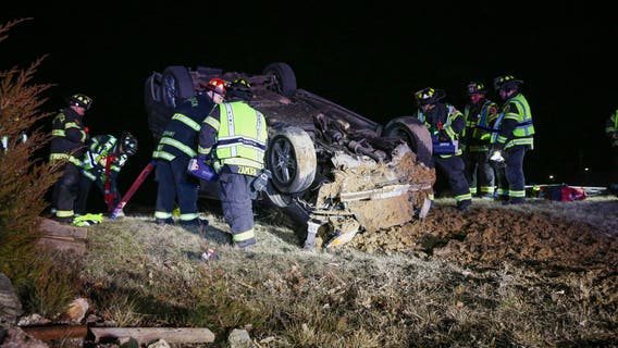 Man trapped, hurt after car flips in Chicago's northwest suburbs