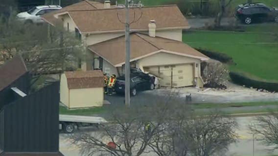 Two hospitalized after multi-vehicle crash sends car into Orland Park home
