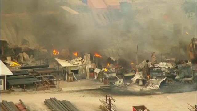 Massive fire breaks out at Joliet area facility; firefighter hurt in roof collapse