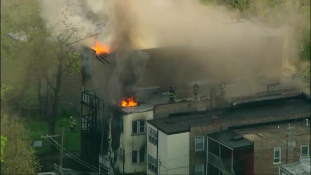Fire spreads between 2 apartment buildings on Chicago's West Side