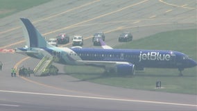 Plane from Chicago skids off Boston airport runway