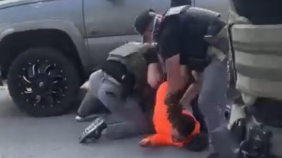 Video shows federal agents detain man in Chicago suburb