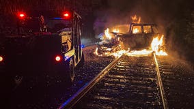 Fiery crash between freight train, vehicle in Chicago suburb leaves driver seriously hurt