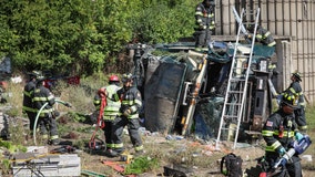 Garbage truck driver extricated after rollover crash in Unincorporated Cary