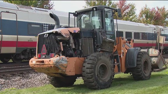 1 hurt after Amtrak train hits construction vehicle in Chicago suburbs, police say