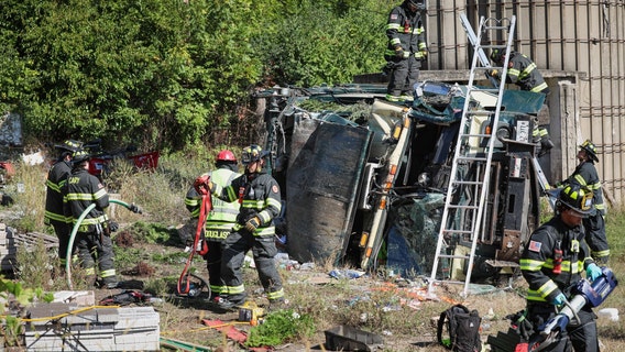 Garbage truck driver extricated after rollover crash in Unincorporated Cary