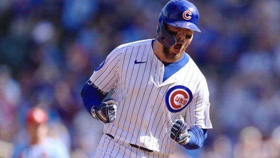 Busch stars as the Cubs beat the Cardinals 7-3 to clinch the top NL wild card