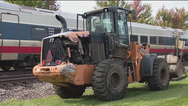 1 hurt after Amtrak train hits construction vehicle in Chicago suburbs, police say