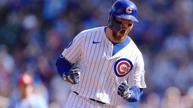 Busch stars as the Cubs beat the Cardinals 7-3 to clinch the top NL wild card
