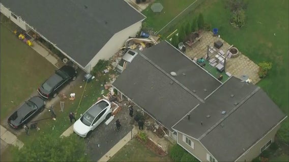 Car plows through suburban Chicago home, leaving 2 people hospitalized: police