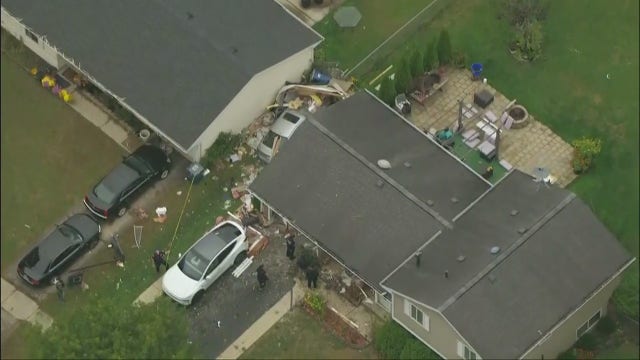 Car plows through suburban Chicago home, leaving 2 people hospitalized: police