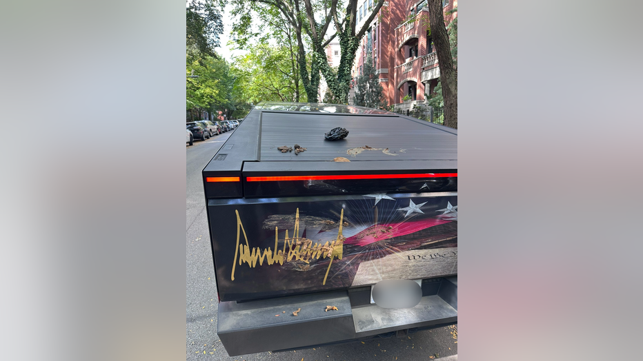 Image of Cyberturck with dog poop smeared on the back