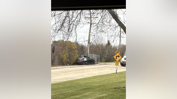 All lanes closed on I-94 after car hits light pole, brings down live wires: police