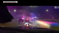 Video shows suburban Chicago police officers saving man from overturned car on fire