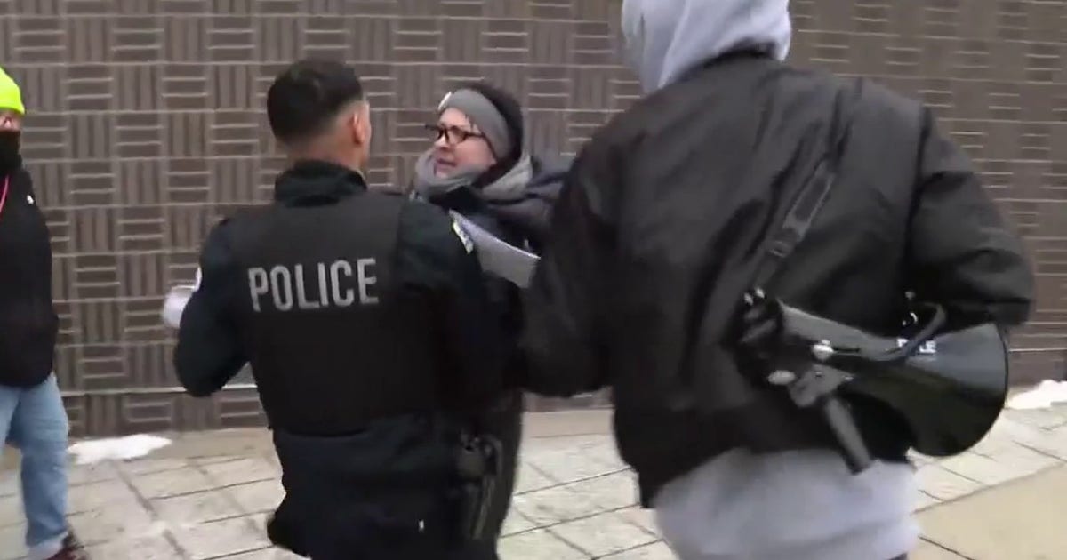 Protest turns heated outside Chicago Police station over fatal officer ...