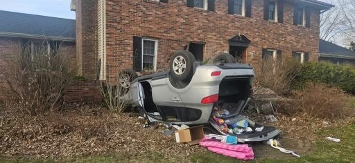 SUV crashes into northwest Indiana home, rolls over