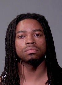 Man charged after police recover drugs, stolen gun in Joliet raid