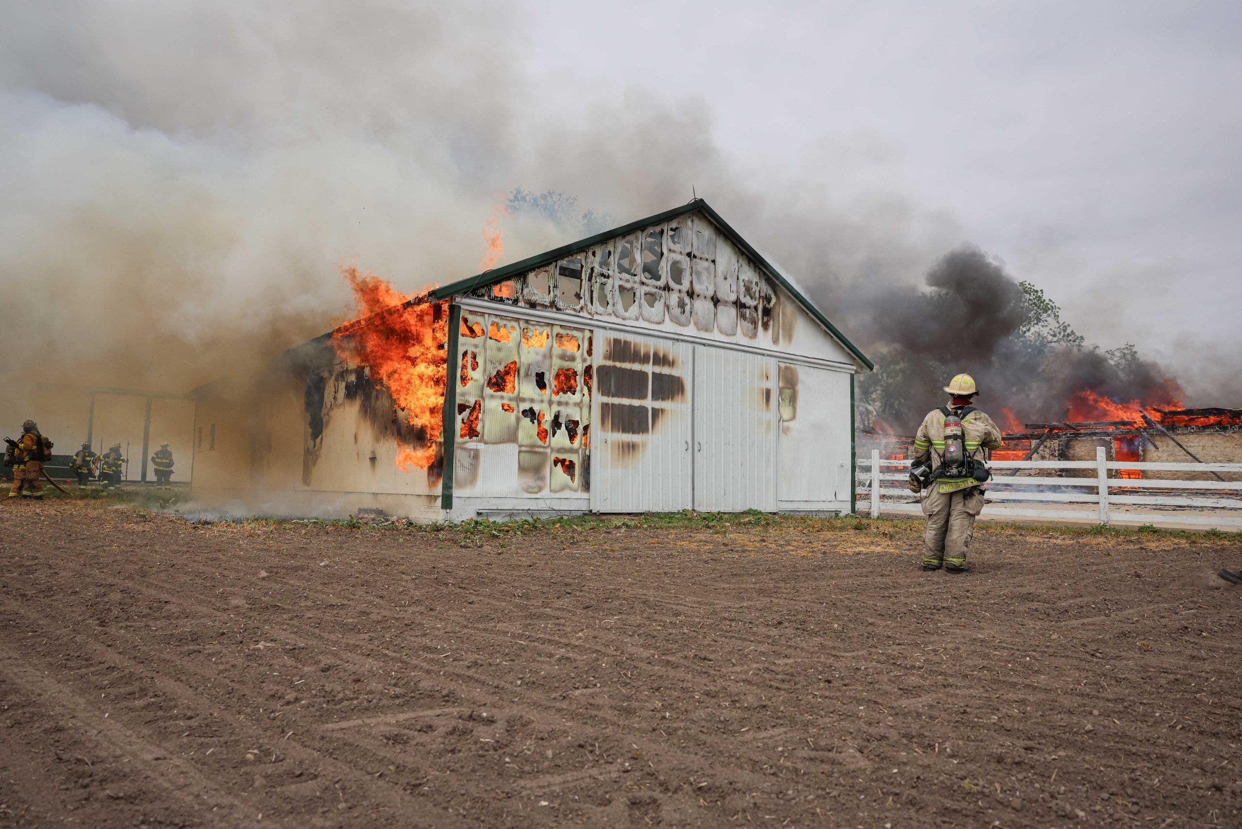 Two barns engulfed in flames in unincorporated Huntley, officials say