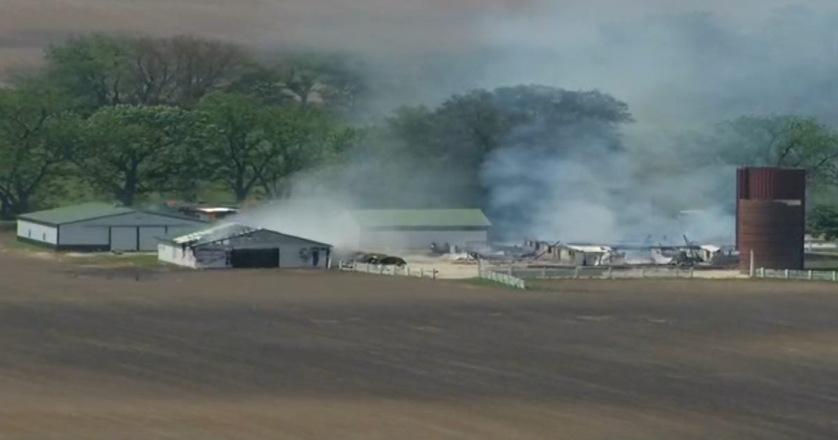 Two barns engulfed in flames in unincorporated Huntley, officials say