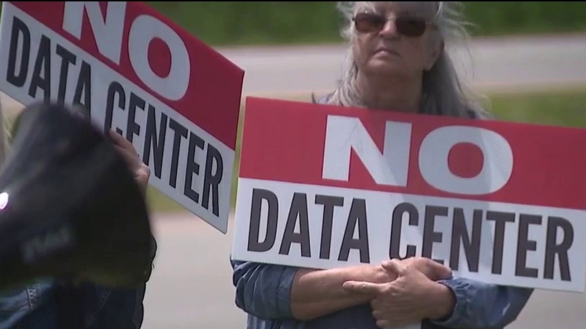 Indiana Protesters Demand Pause on Data Centers outside event with Gov. Mike Braun
