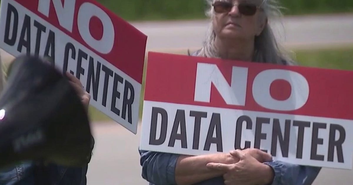 Indiana Protesters Demand Pause on Data Centers outside event with Gov. Mike Braun