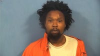 Aurora man accused of punching multiple people, spitting on officer at festival