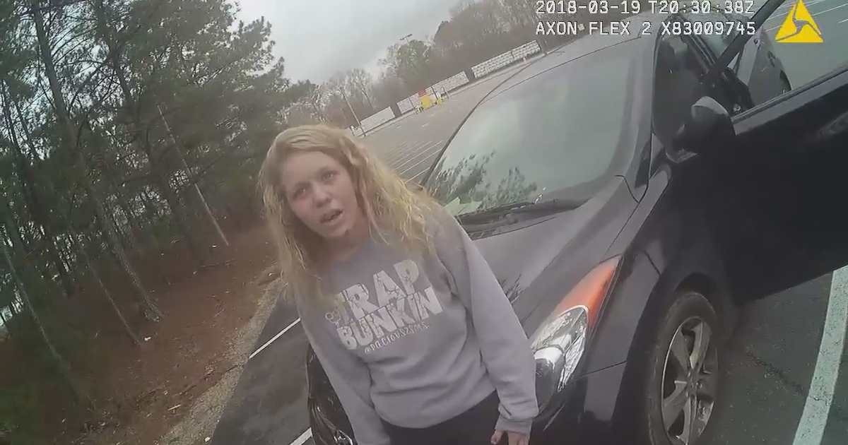Video: Police confront mother accused of smoking drugs in car with ...