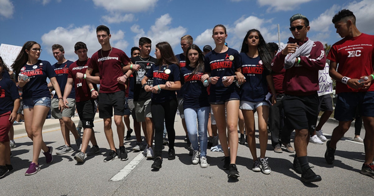 Protesters go silent during march at Parkland high school in honor of ...