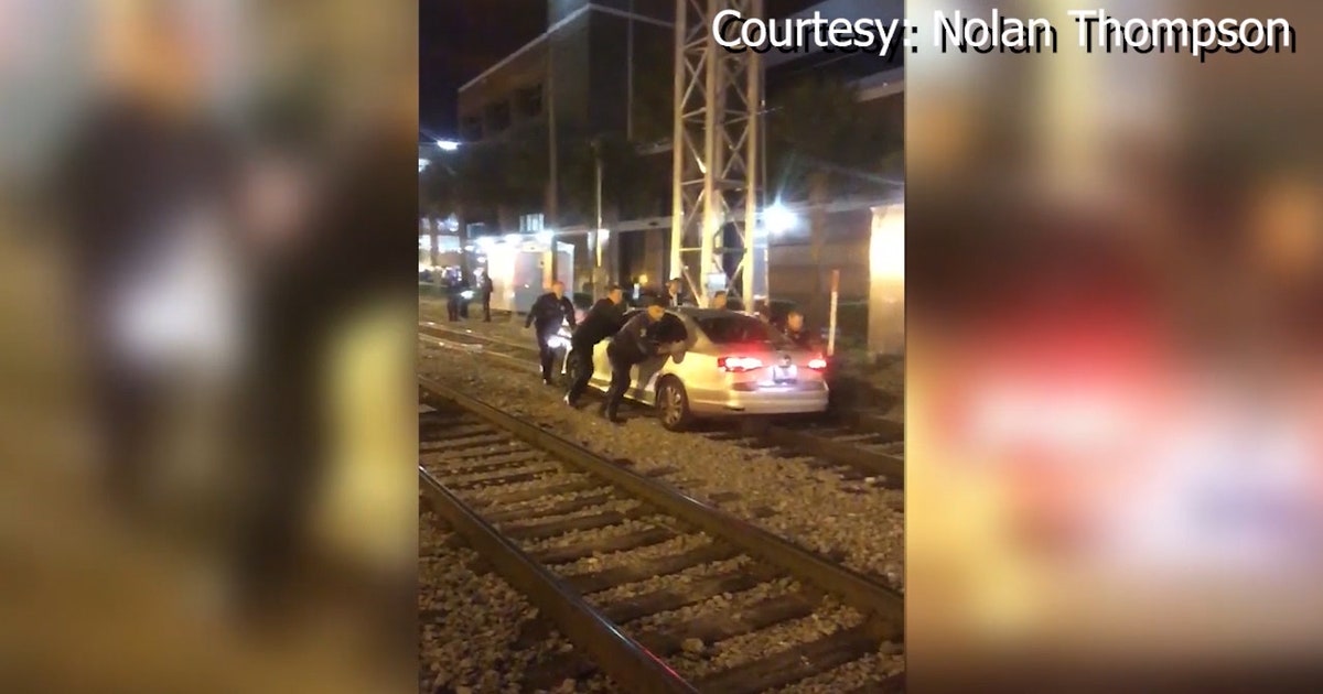 Orlando firefighters save woman who drove onto train tracks | FOX 35 ...