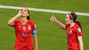 U.S. Soccer's Alex Morgan sips the tea after scoring goal against England on her birthday