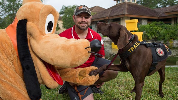 Invictus Games service dogs meet Mickey Mouse, Pluto