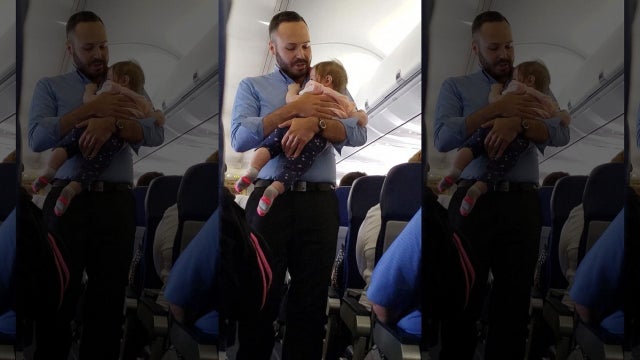 Southwest flight attendant comforts crying baby in viral video