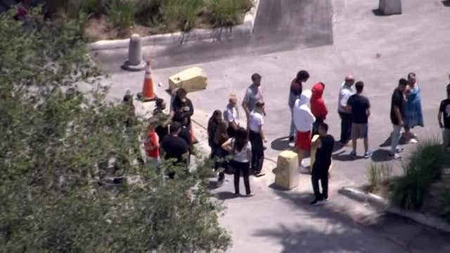 Large group of fans view casket of rapper XXXTentacion at arena
