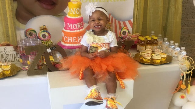 Brave one-year-old proudly rings hospital's 'cancer free' bell