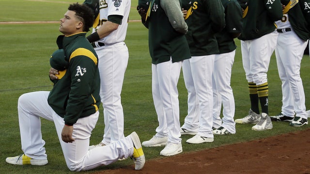 Oakland's Maxwell first MLB player to kneel during anthem