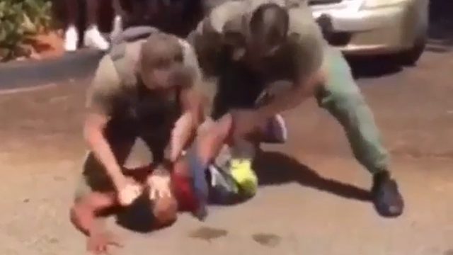 Florida deputy ordered to surrender gun and badge amid viral video of him slamming teen's head