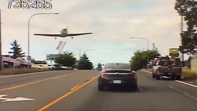 WATCH: Small plane lands on Washington state road, shocking drivers