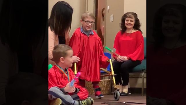 Boy with spina bifida walks for first time at preschool graduation