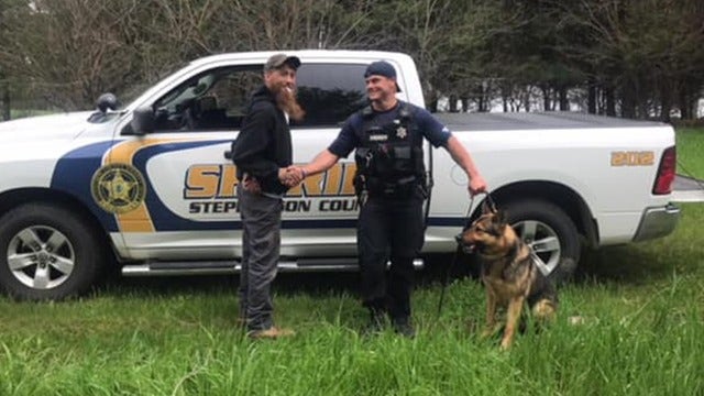 Captured suspect poses for photo, congratulates K-9 team that busted him