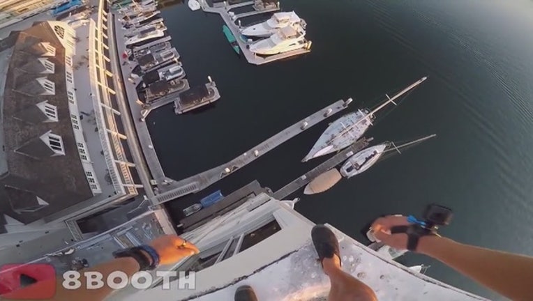 3e835d4b-Daredevil with GoPro jumps from Newport Beach dockside building-407068.JPG