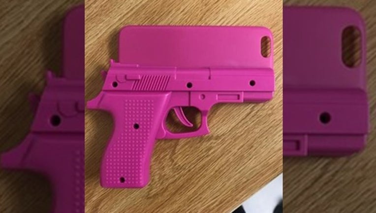 a091ffa0-DELAND PD_pink gun phone case_100418_1538669021535.png.jpg